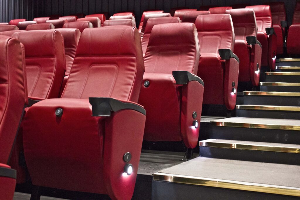 Evening in the City - Barbican Cinemas - rows of red leather recliner cinema theatre chairs 