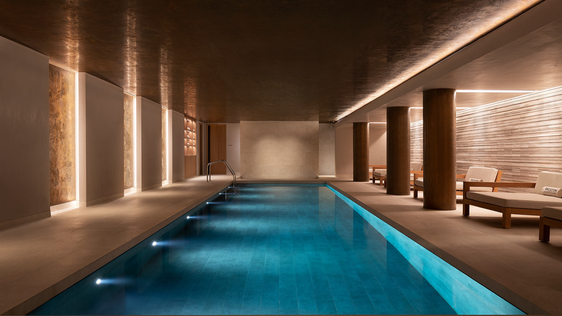 5 best Spas in the City of London - Heavenly Spa Pool - pristine still indoor pool with loungers along the side