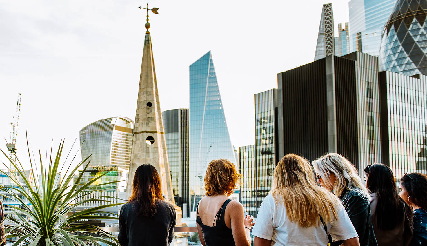 11 Rooftop Bars & Restaurants in the City of London - Jin Bo Law Skybar - group of people stood with drinks on roof terrace