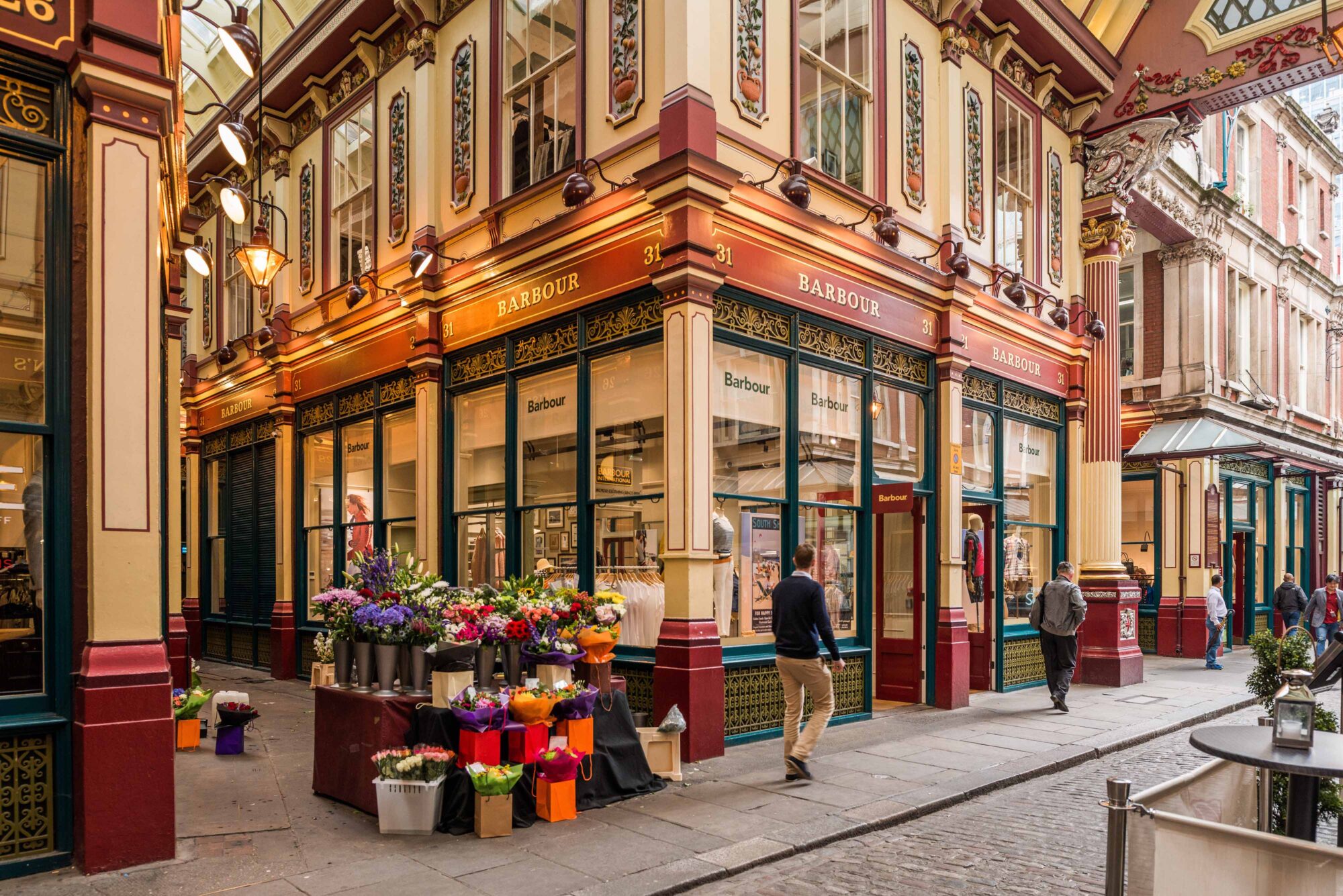 Luxury shopping in the City - Leadenhall market shop - red and yellow walled market - flowers for sale