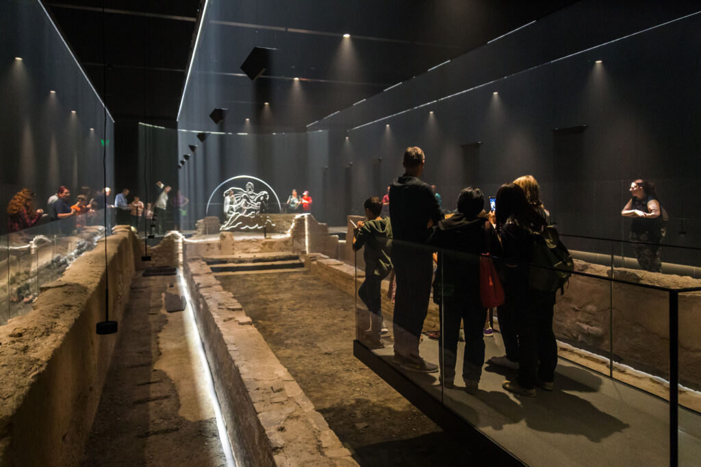 Roman ruins in the City of London - London Mithraeum Bloomberg SPACE - Roman ruins in exhibition space, groups of visitors