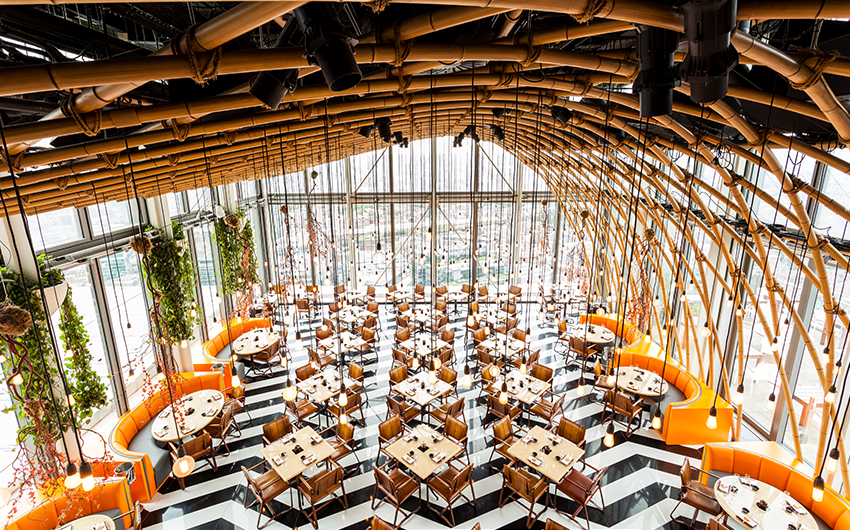 11 Rooftop Bars & Restaurants in the City of London - SushiSamba - high ceiling space, zigzag black and white tiled floor with lots of dinnig tables