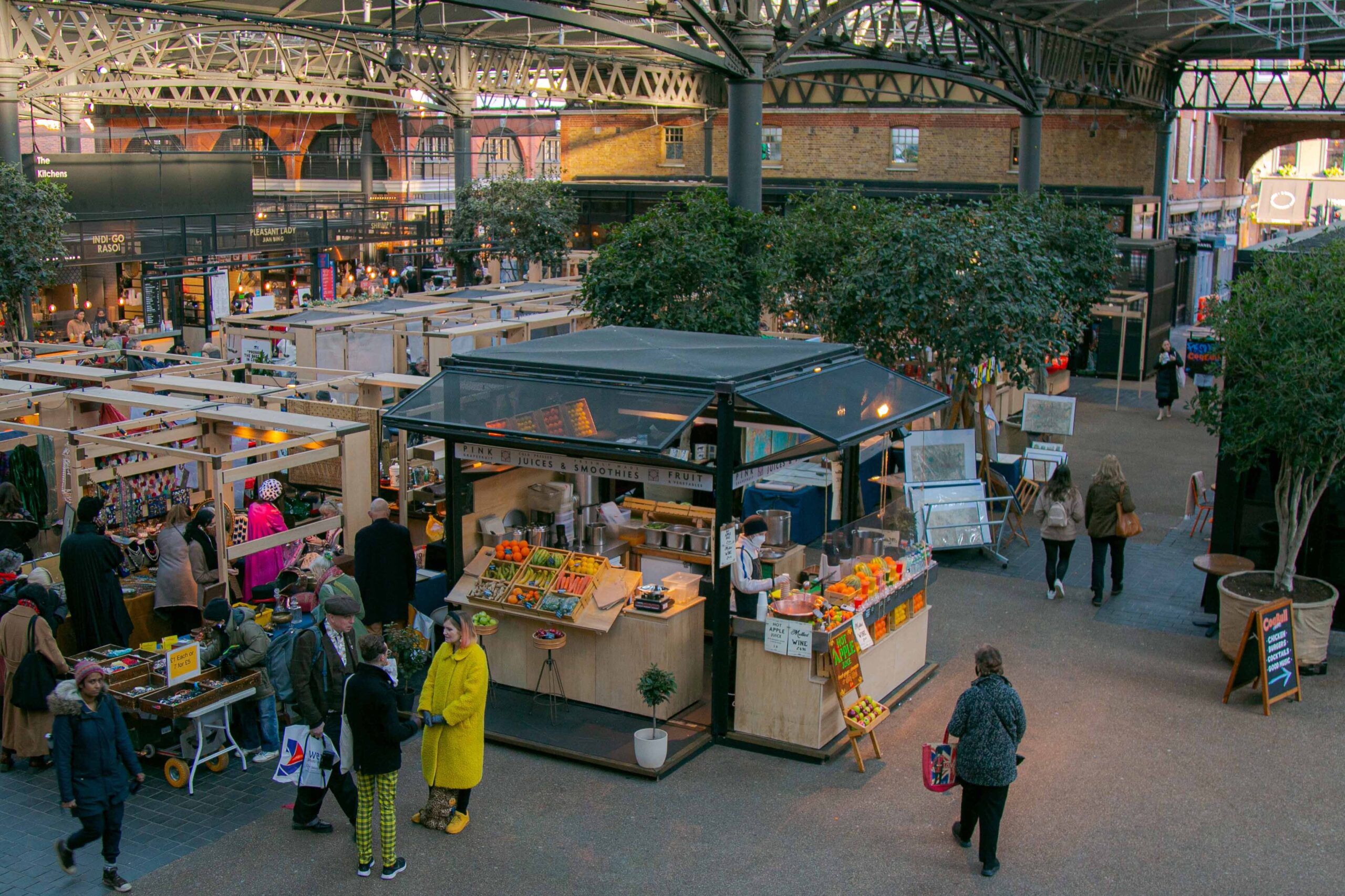 Best Independent Shopping Experiences - Spitalfields Market - large indoor market with many market stalls 