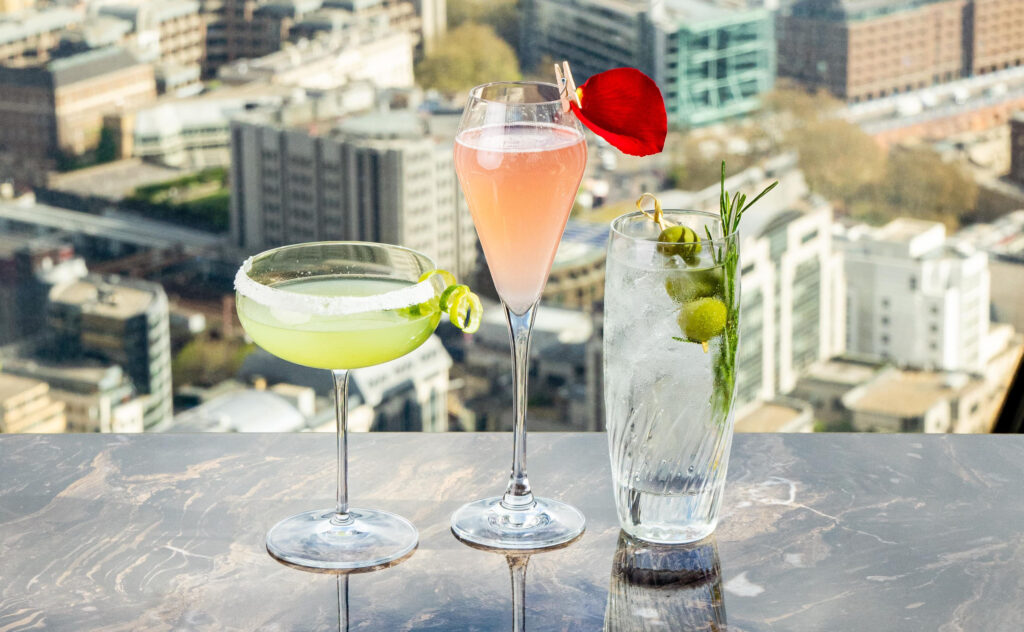 Afternoon Tea Spots in the City of London - Searcys at The Gherkin - 3 cocktails short green, fizzy peach and a long clear