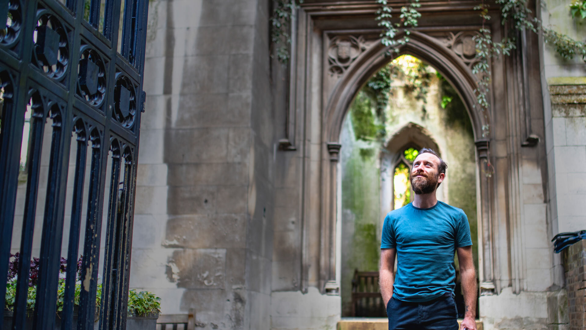 8 best Instagrammable places in London - St Dunstan in the East - man looking up at rol plant covered church ruins