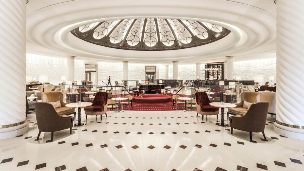 Afternoon Tea Spots in the City of London - Four Seasons Hotel London - grand white circular room tiled floors and armchairs around small tables