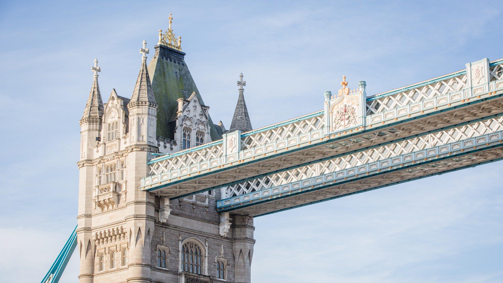 Family Fun Activities to Enjoy on the Weekend in the City of London - a picture of tower bridge on a sunny day, cropped to show just the tower an upper part of the bridge