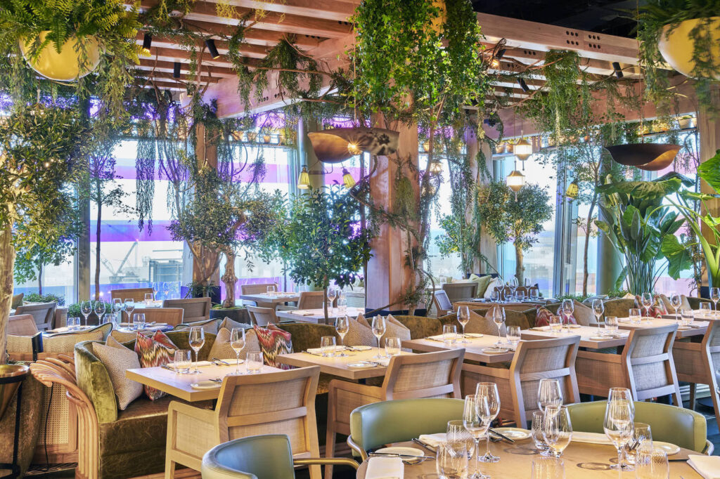 14 Hills - glamorous restaurant - dinning room with plants hanging in pots from the ceiling