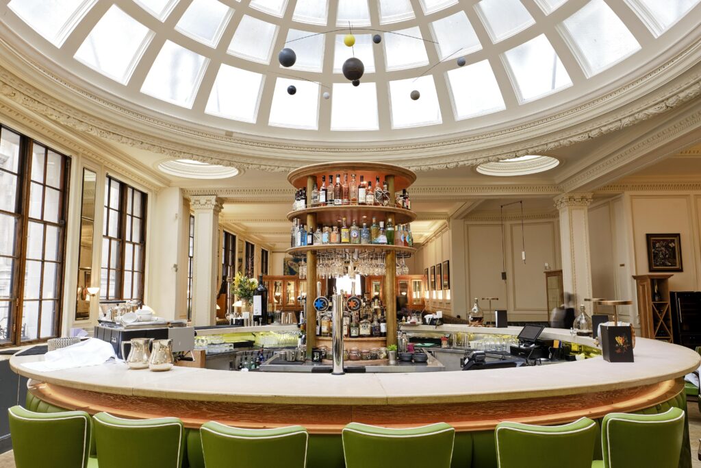 1 Lombard Street - large circular bar - glass ceiling - green bar stools