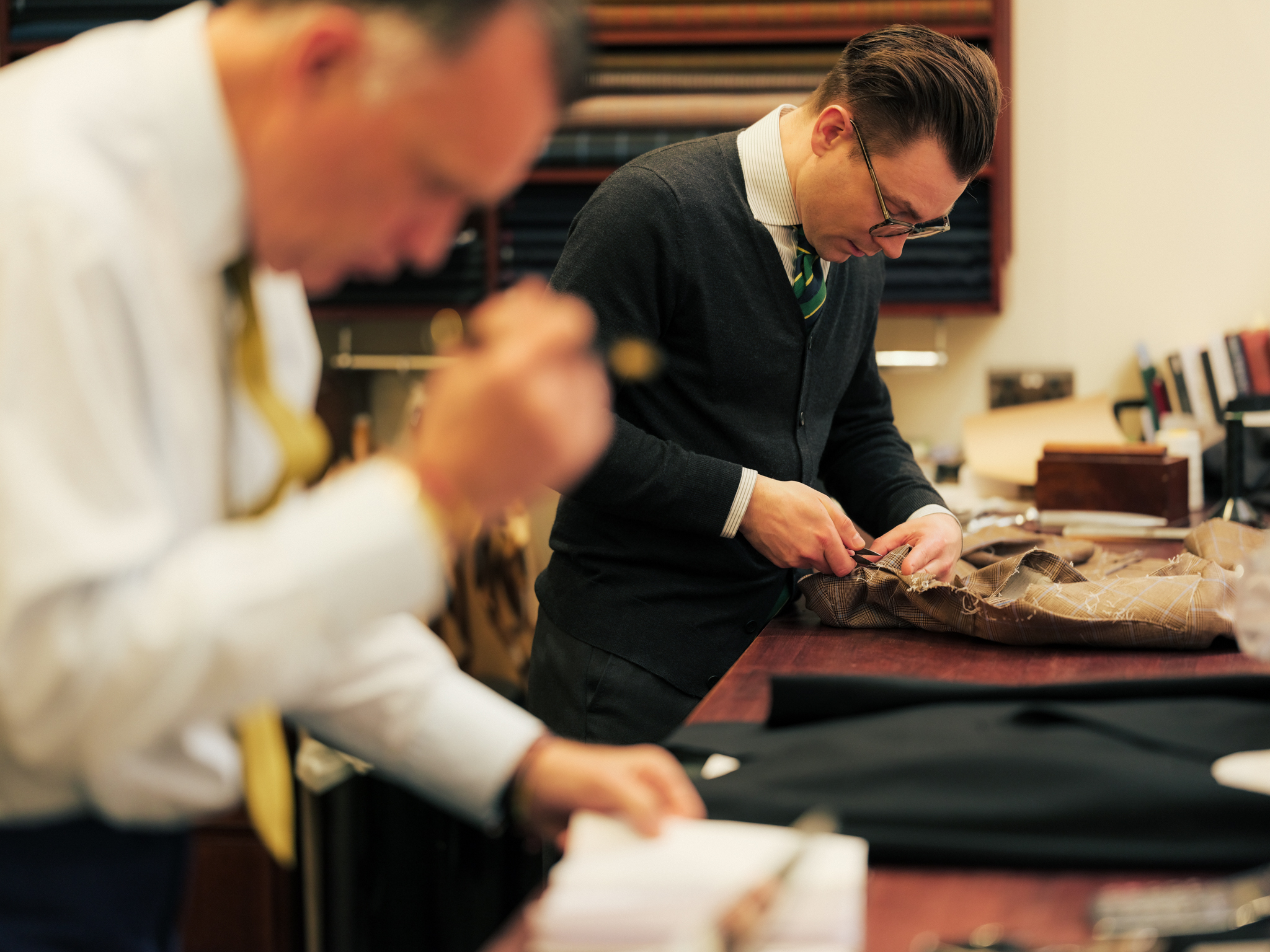 Luxury shopping in the City - tailors at work 