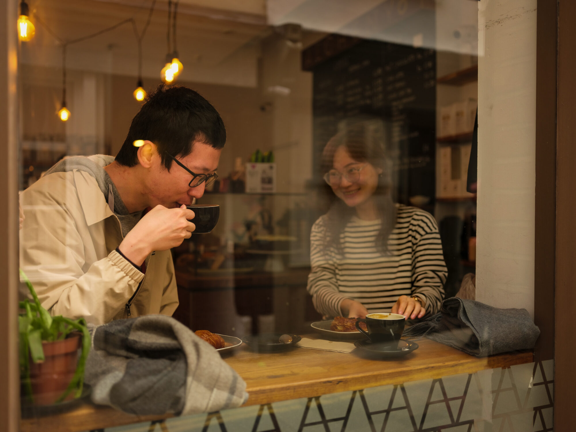 Food and Drink - couple in cafe with coffee