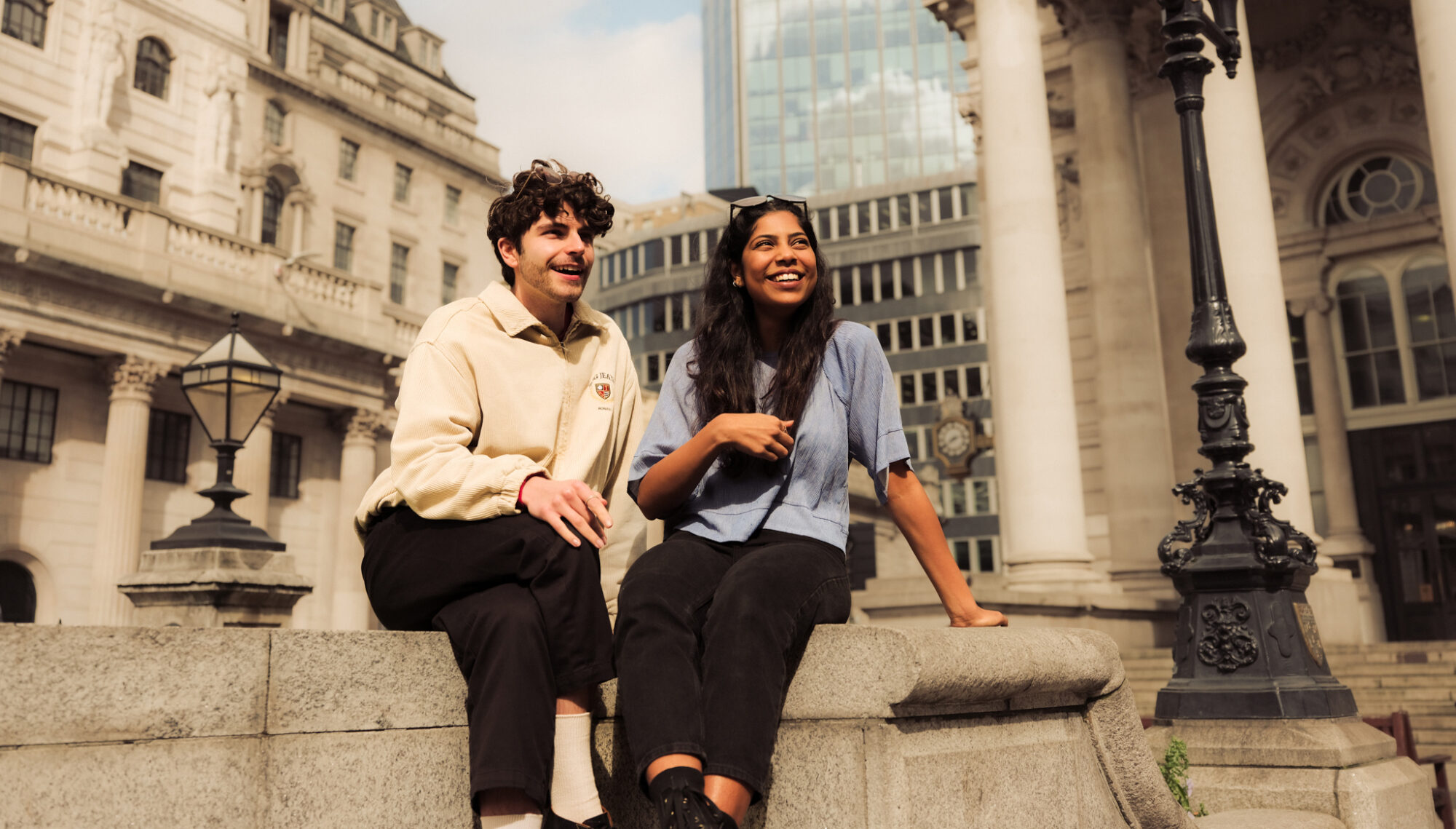 Our story - people sat in front of The Royal Exchange