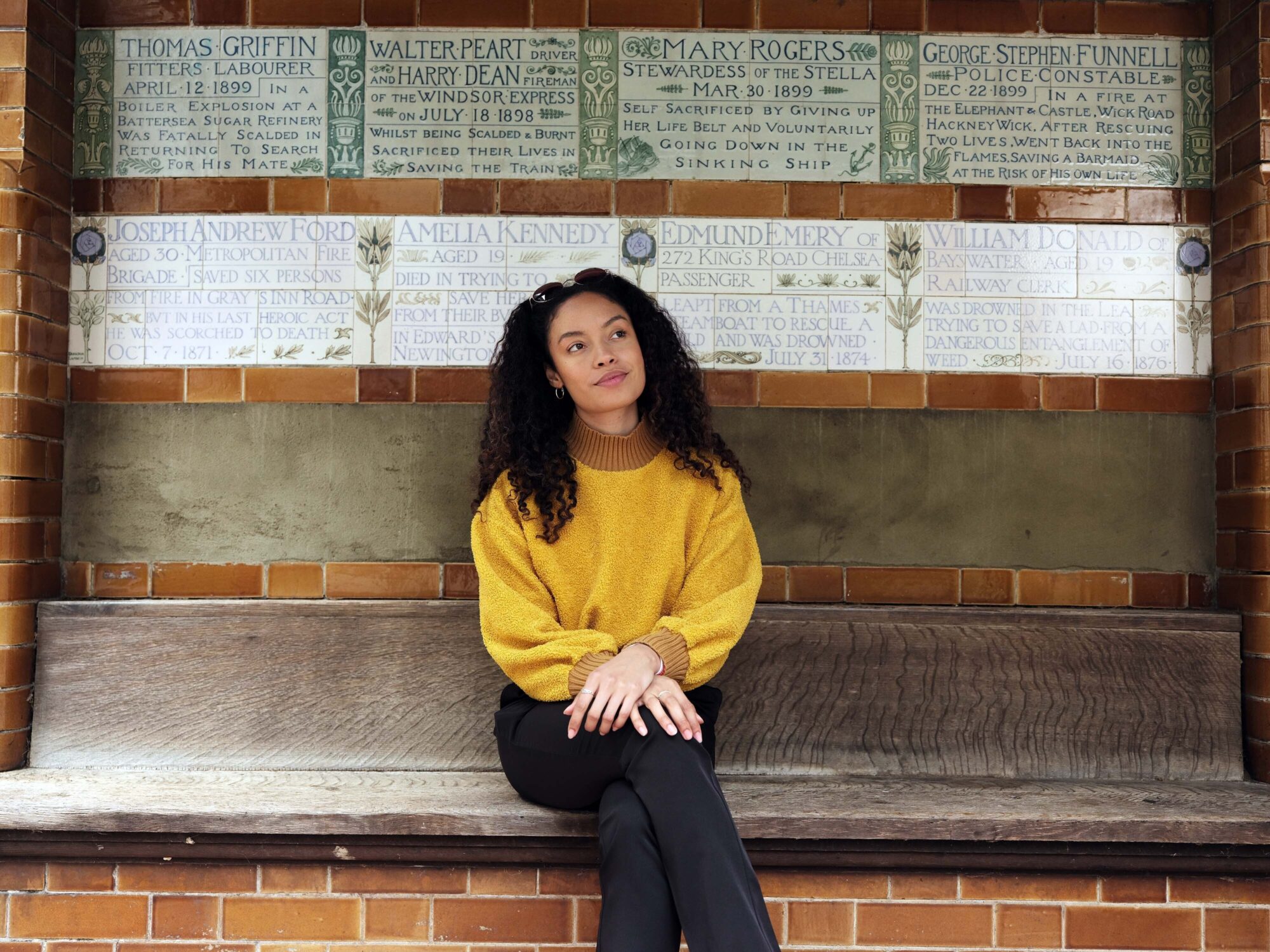 Our Story - woman sat on bench