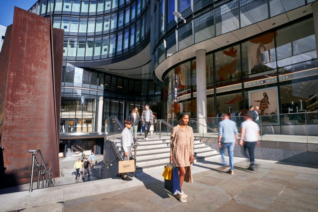 Exterior view of Broadgate centre - a modern building with people walking around outside.