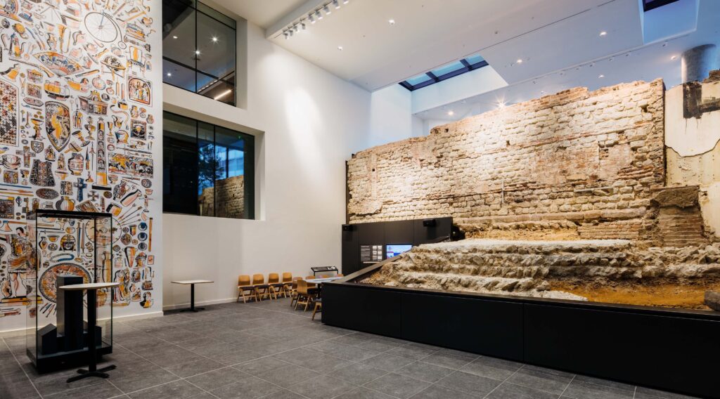 City Wall at Vine Street - part of the roman wall housed inside a gallery space - information displays