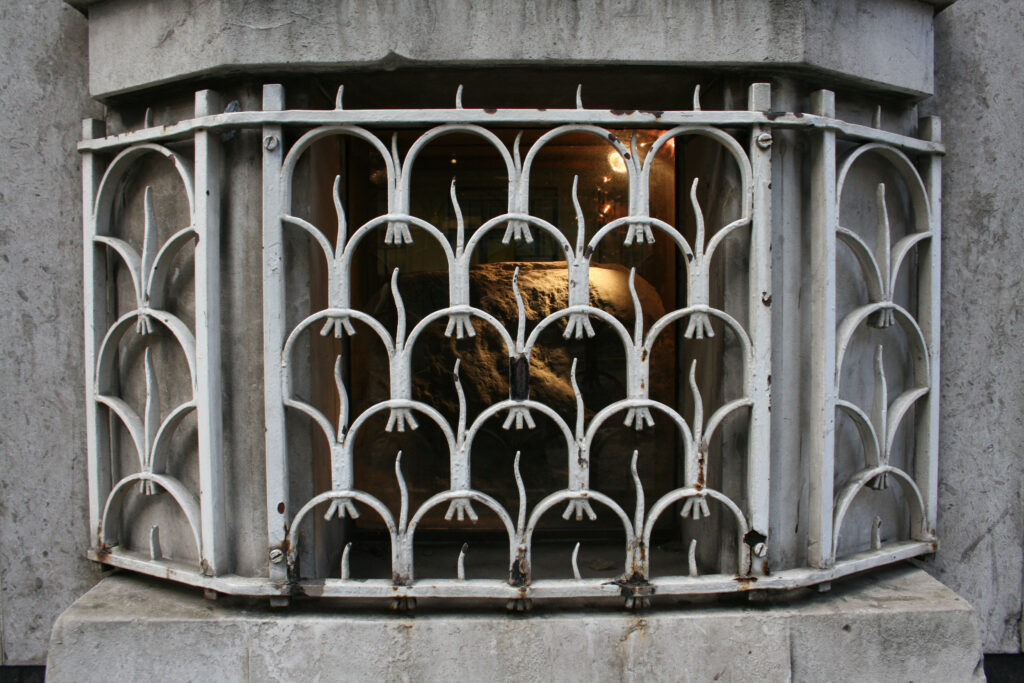 Roman ruins in the City of London - London Stone - view of the stone though a window 