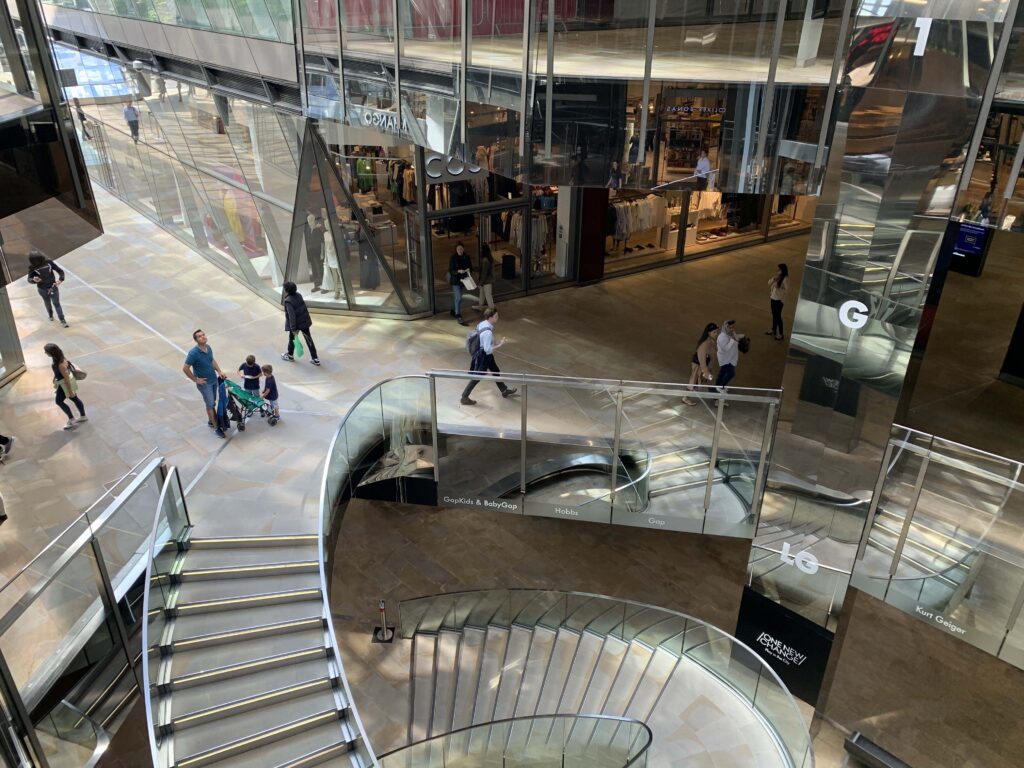 Luxury shopping in the City - One New Change - view of glass and metal clad shopping centre walkways