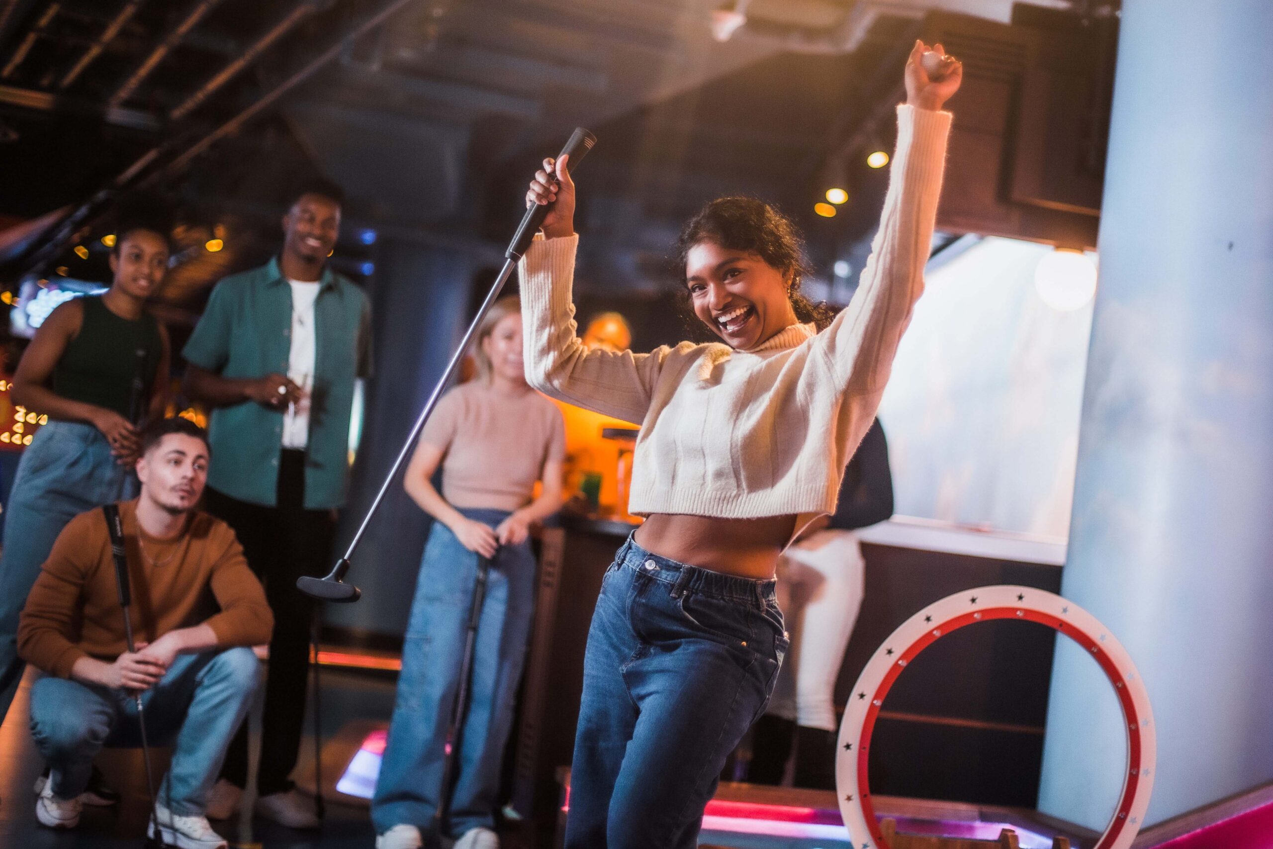 Best Social Activities to Try in the City of London - puttshack - group of friends playing crazy golf