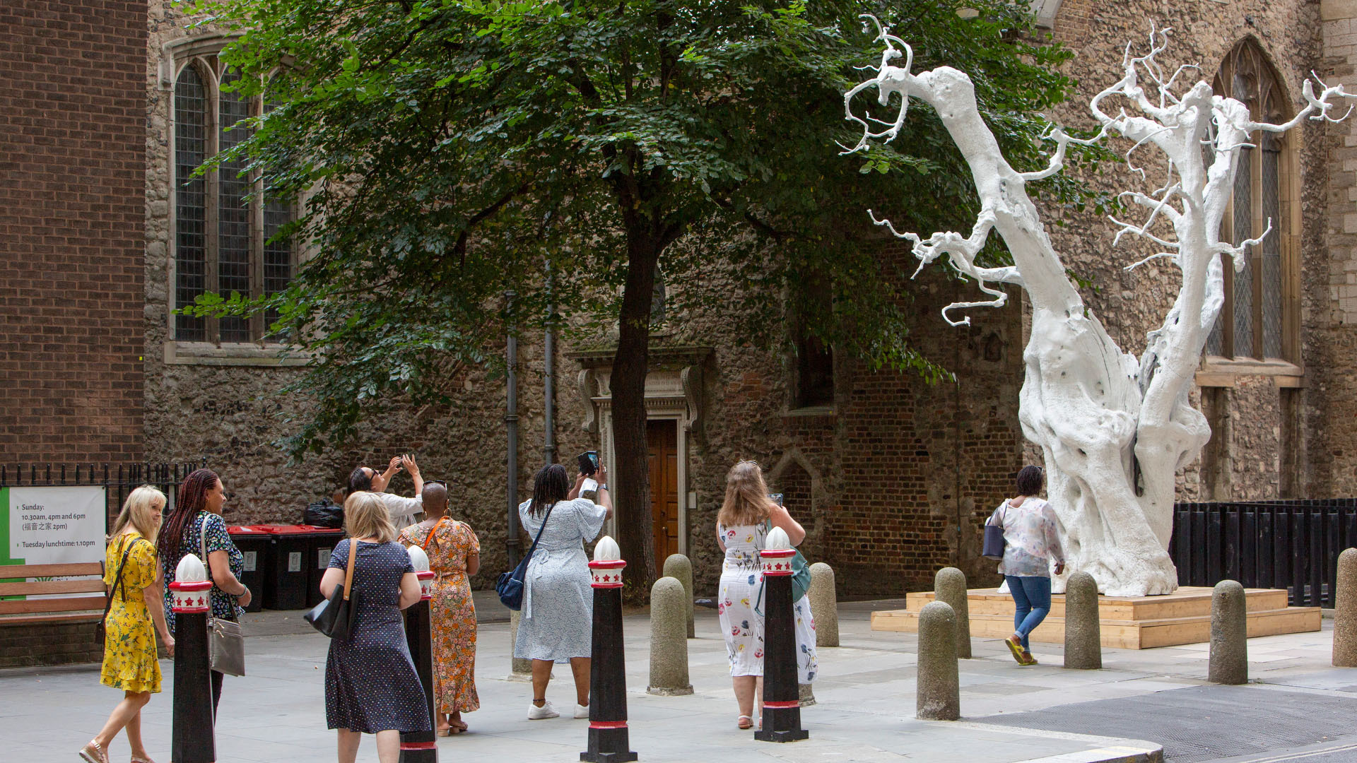 What's On - Sculpture in the City tour, people looking at a white tree sculpture