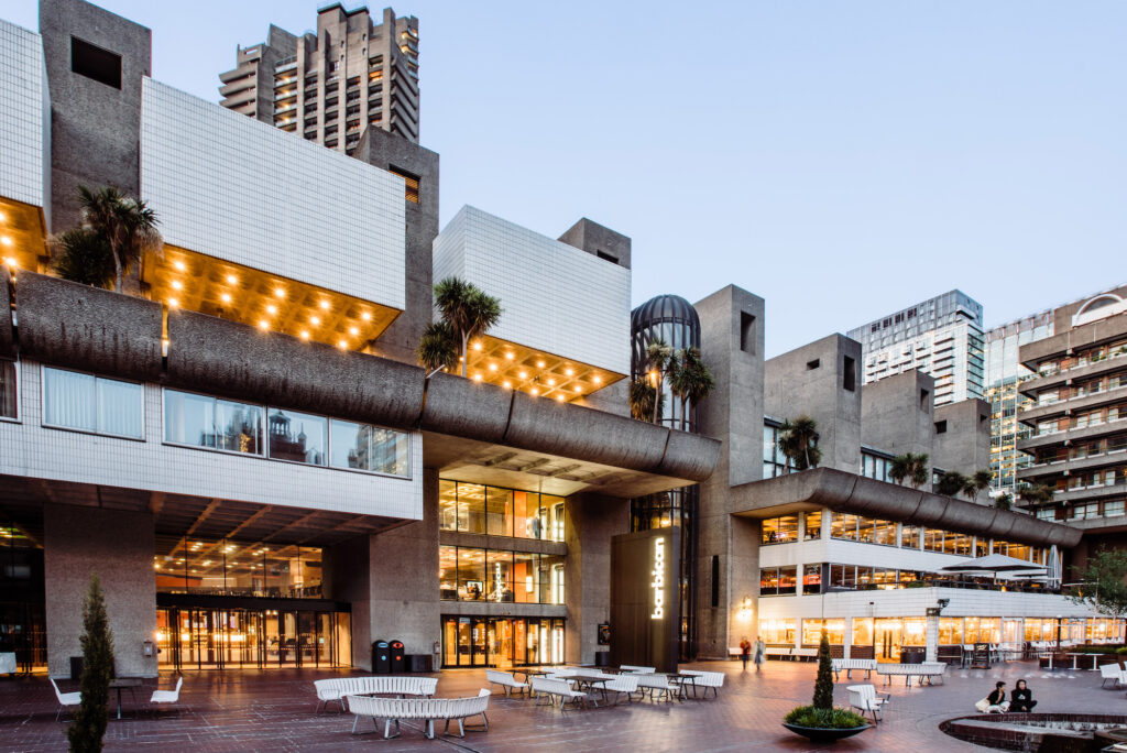 Barbican Centre - large concrete brutalist building - with multiple terraces and outdoor seating