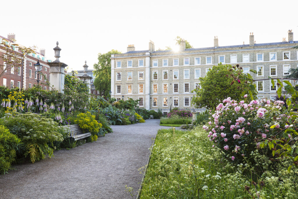 Inner Temple - classical large park garden - planted beds - straight line pathwats - wooden bench