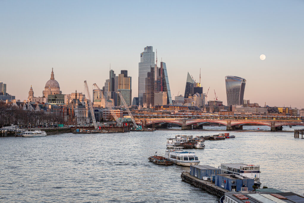 City of London skyline from the river Thames at sunset