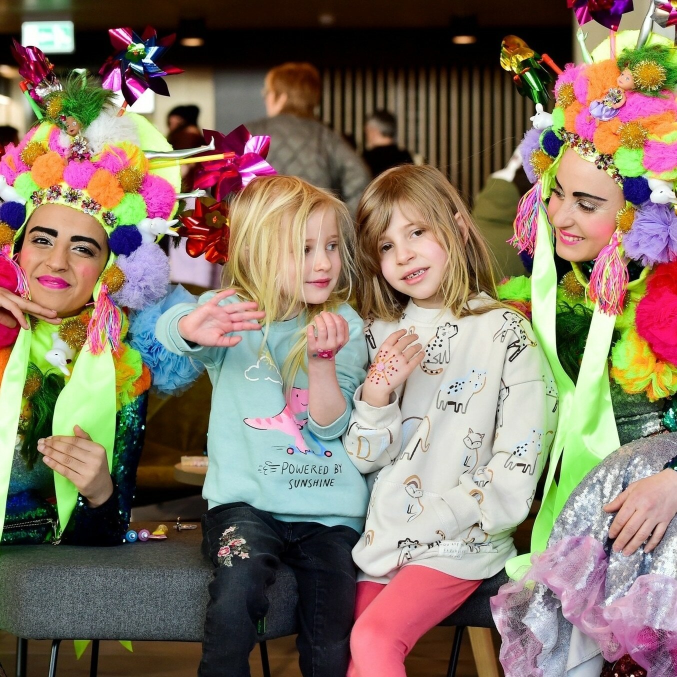 two girls and two women dressed as flowers