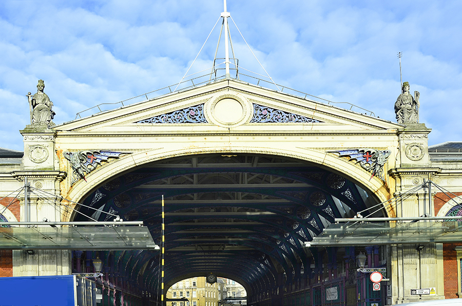 Entrance of Smithfield market with blue details on stone roof