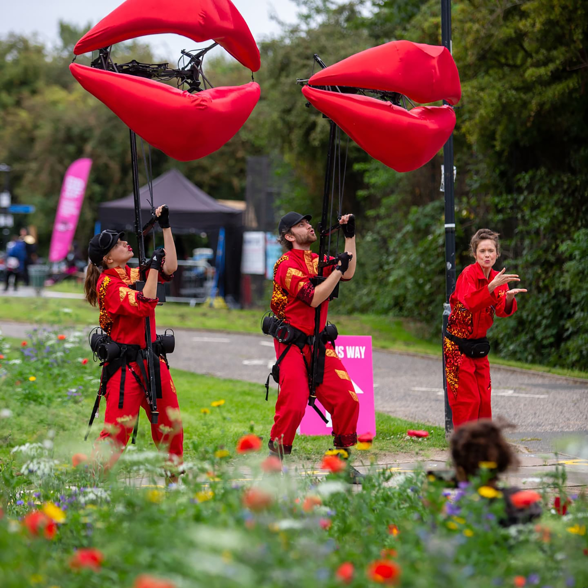 three people holding giant lips