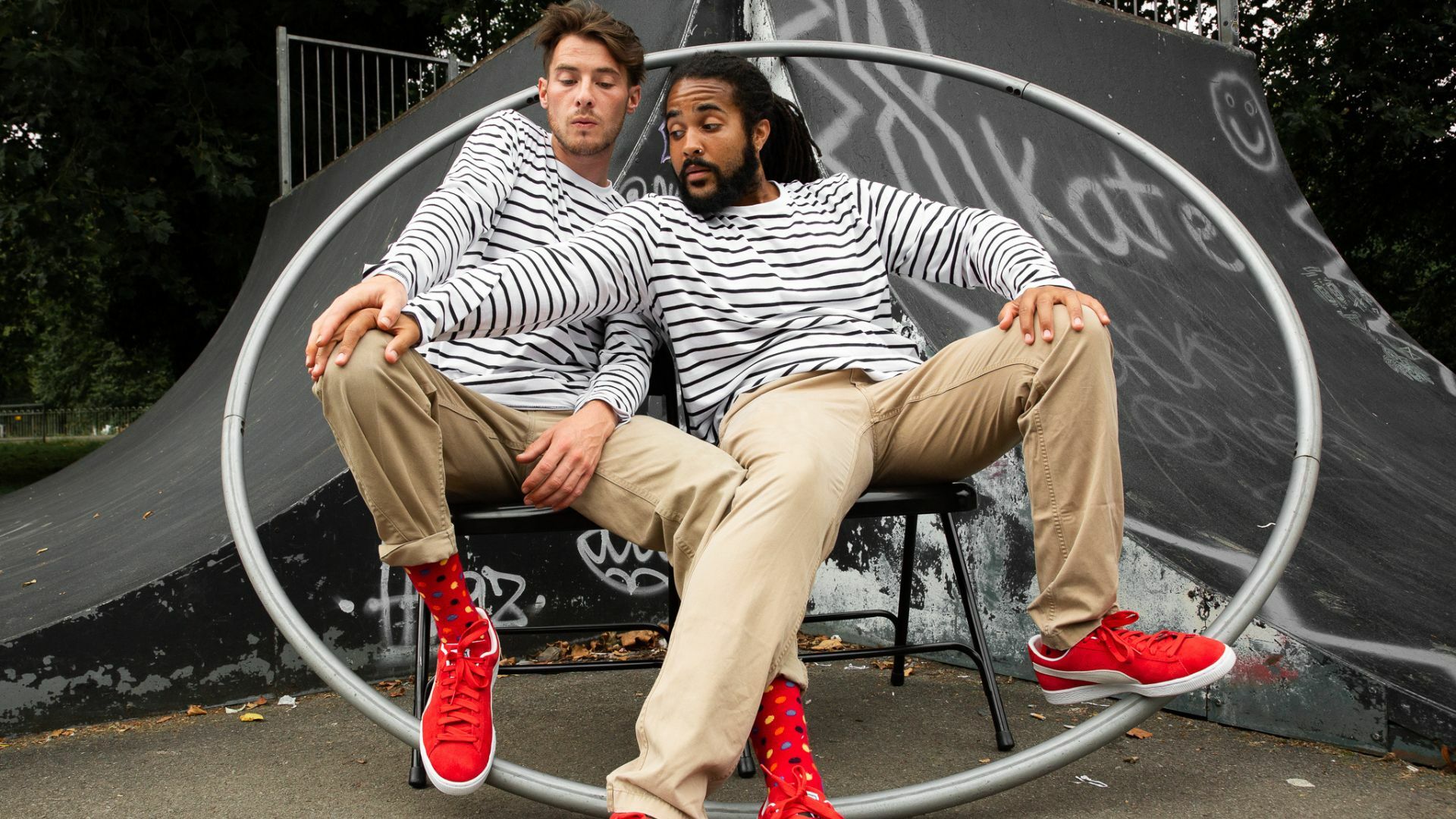 two men sitting on chairs