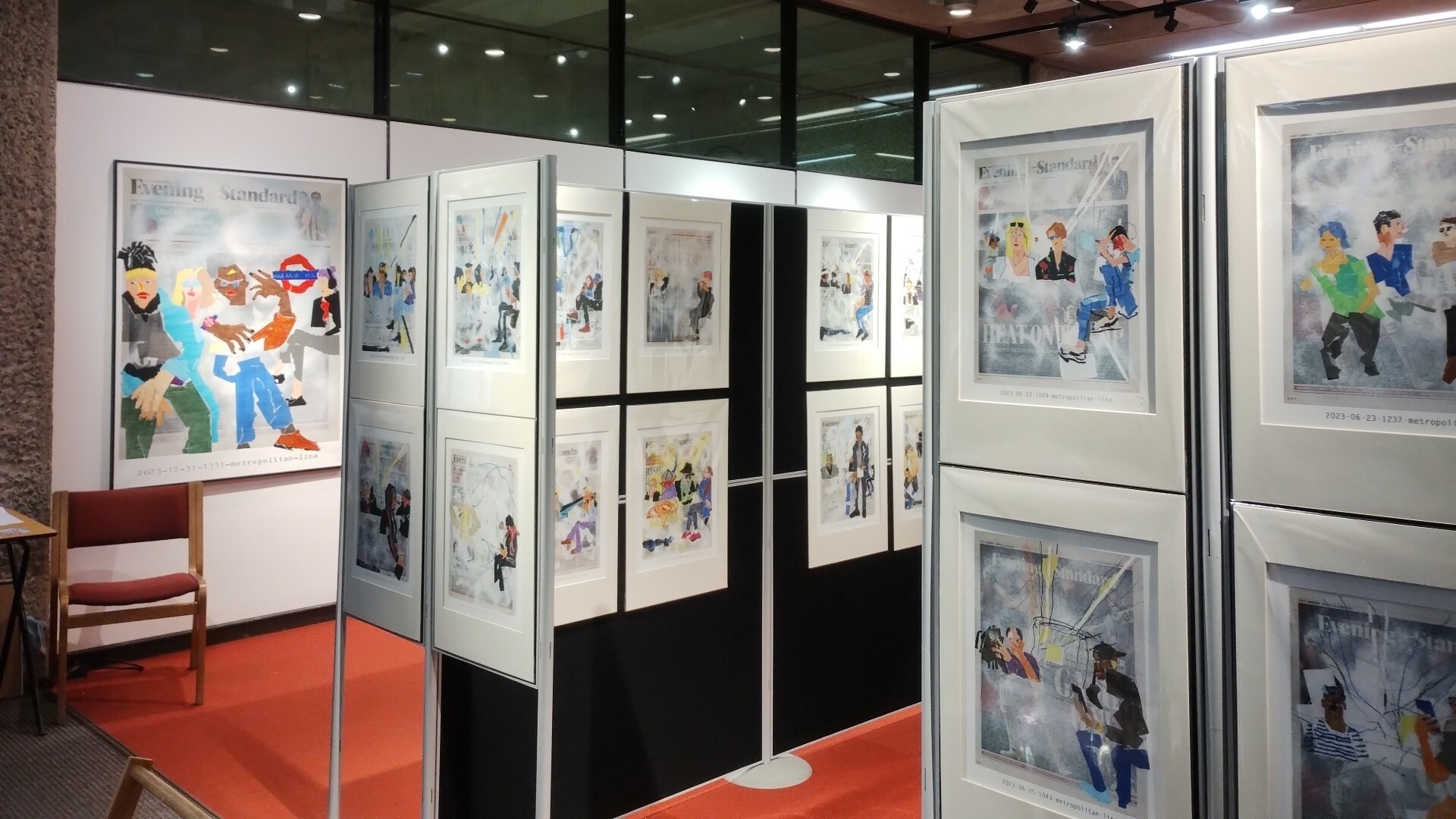 Art exhibition, with artworks on walls.