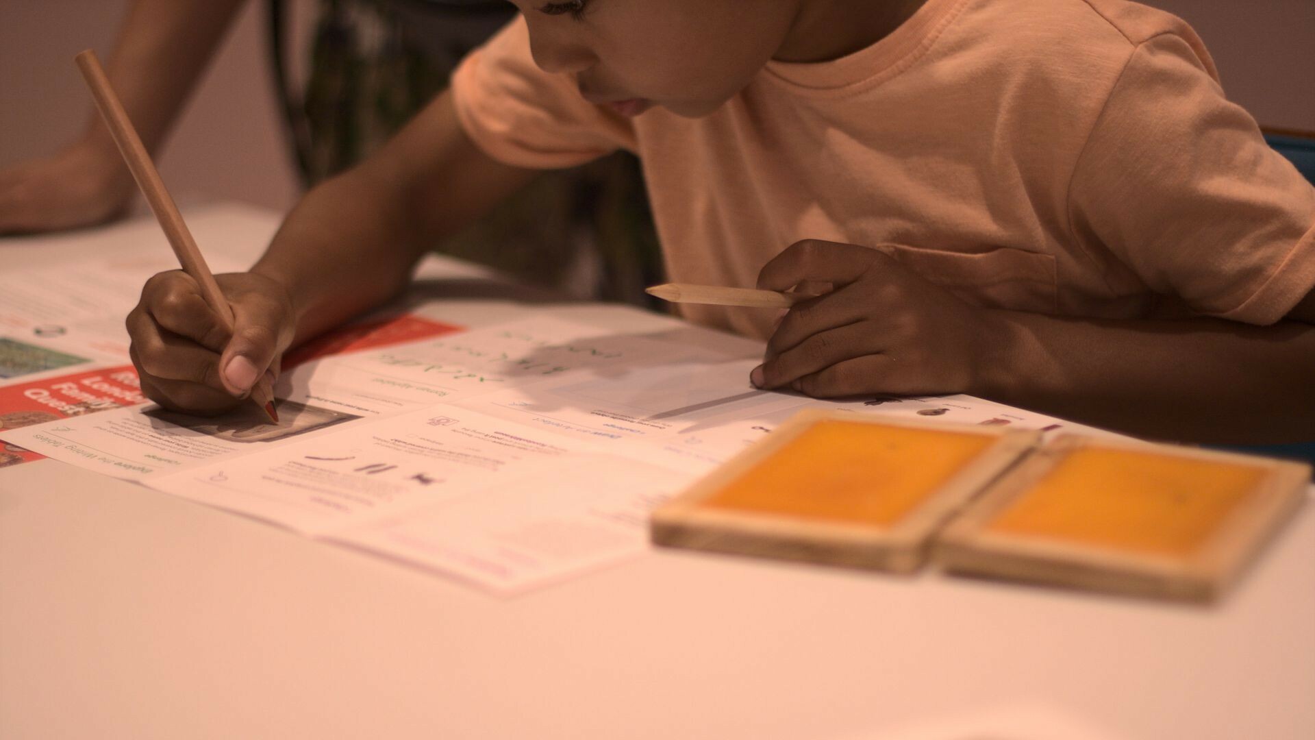 A child is participating in a writing activity