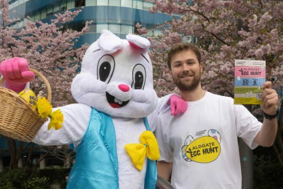 man standing with someone dressed up as the easter bunny