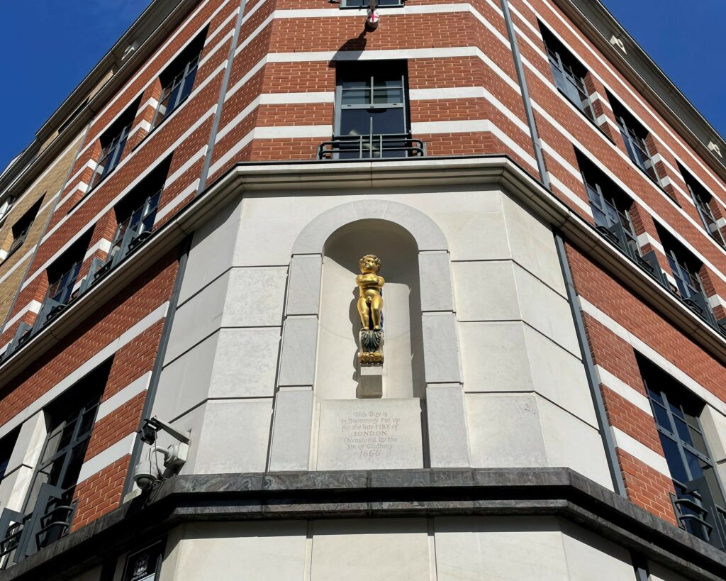 Statue entitled 'Golden Boy at Pie Corner'