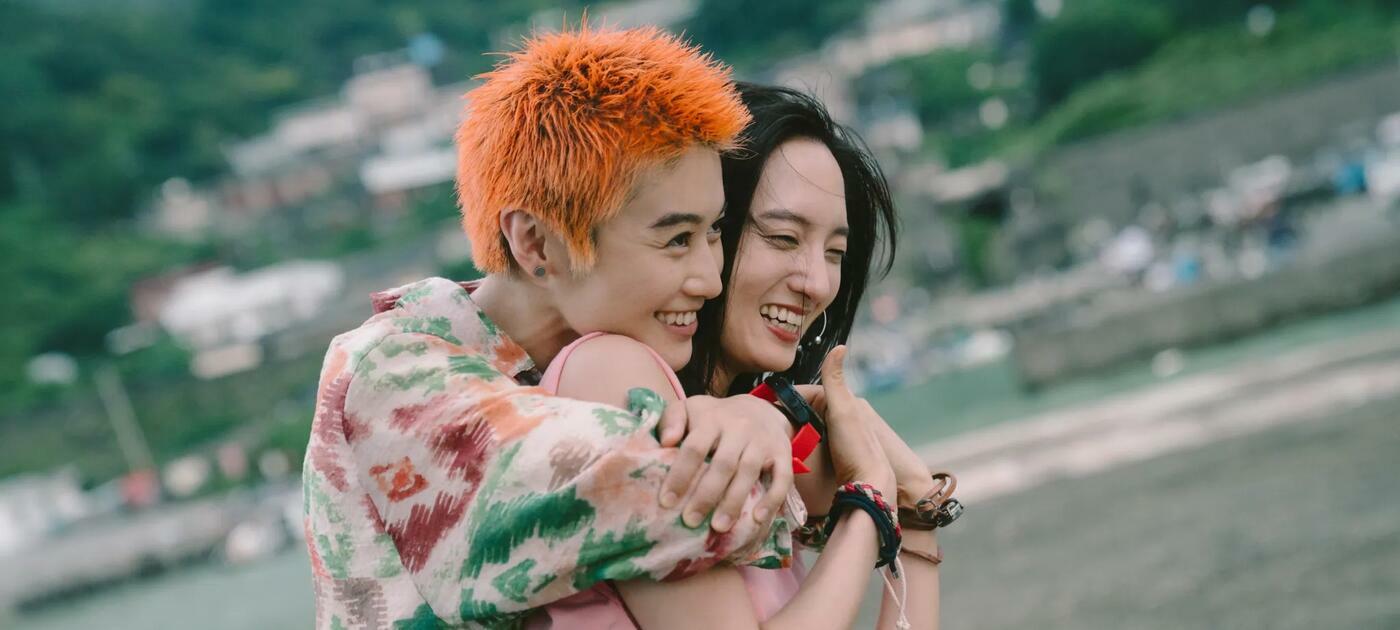 An image from a film showing two people hugging each other