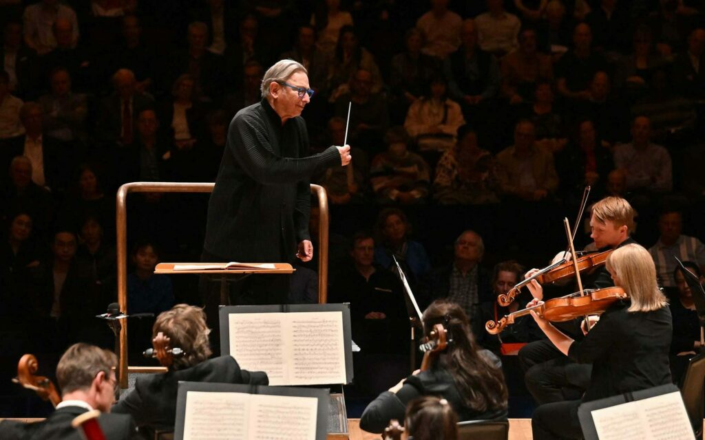 Conductor Michael Tilson Thomas with orchestra