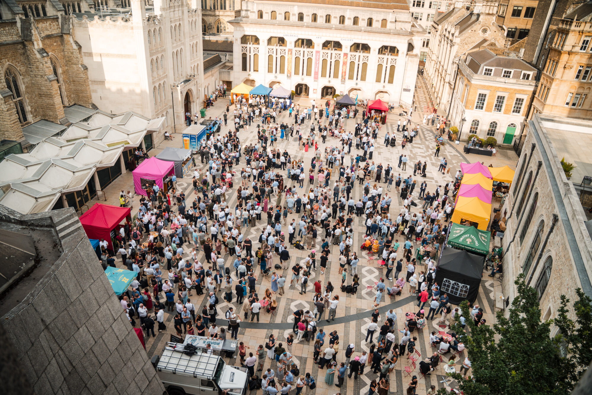 Wide image of Guildhall Yard with a crowd
