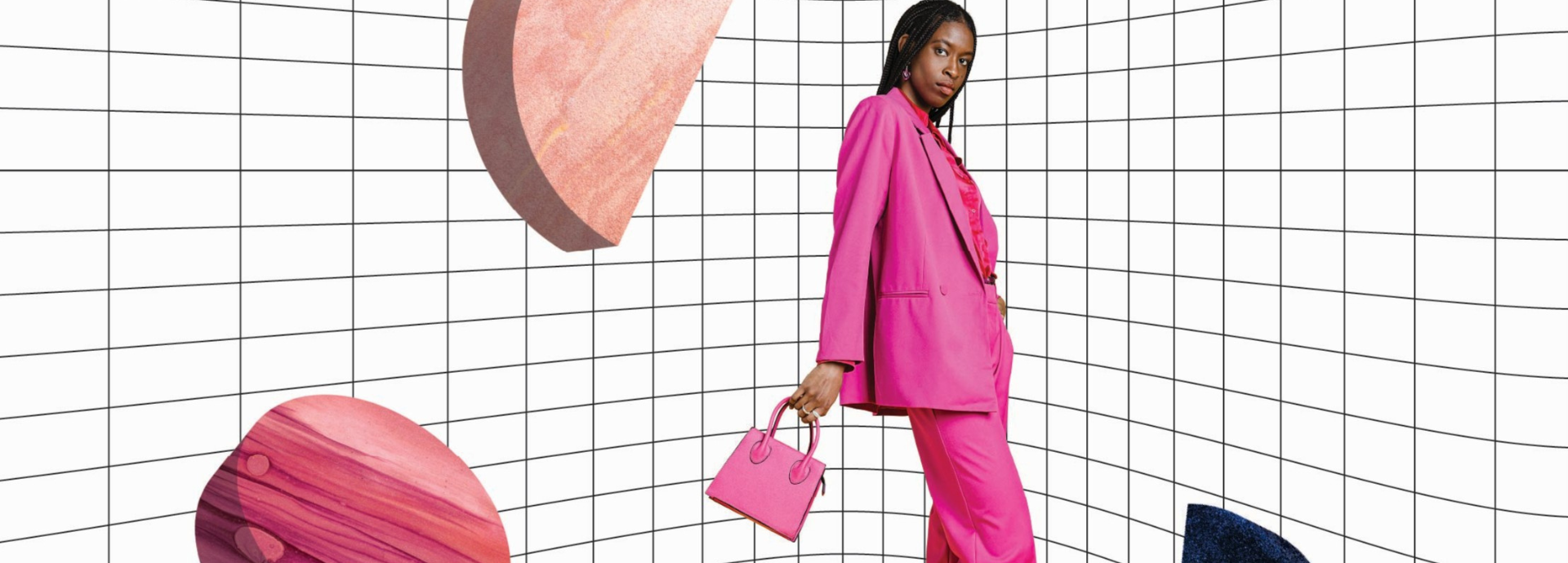 A person wearing a bright pink suit and holding a matching pink handbag stands confidently in a stylized setting with oversized floating gemstones and a grid background.