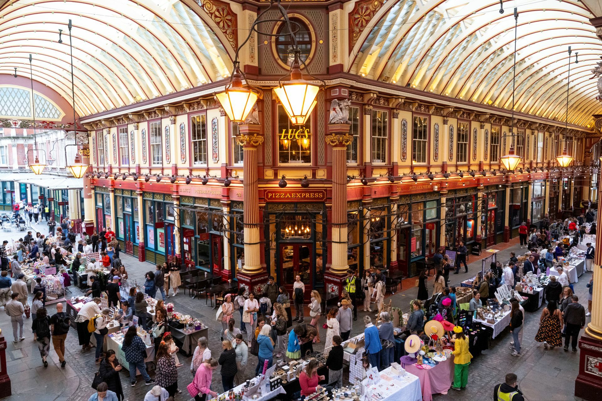 A pop-up market with its temporary stalls is installed inside Leadenhall Market