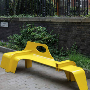 A yellow bench branching off in different directions
